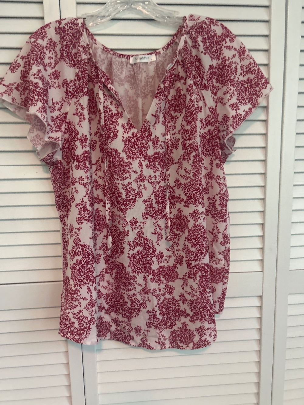 Red and cream blouse